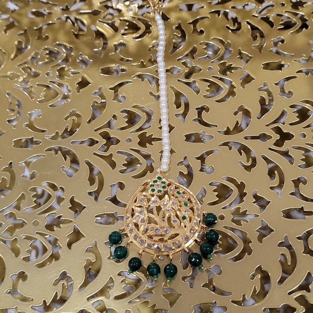 Elegant gold and green headpiece/tikka